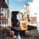 CAT 301.7 mini excavator operating at a compact construction site in Seattle – showcasing key features and performance benefits for those searching for CAT 301.7 mini excavator details.