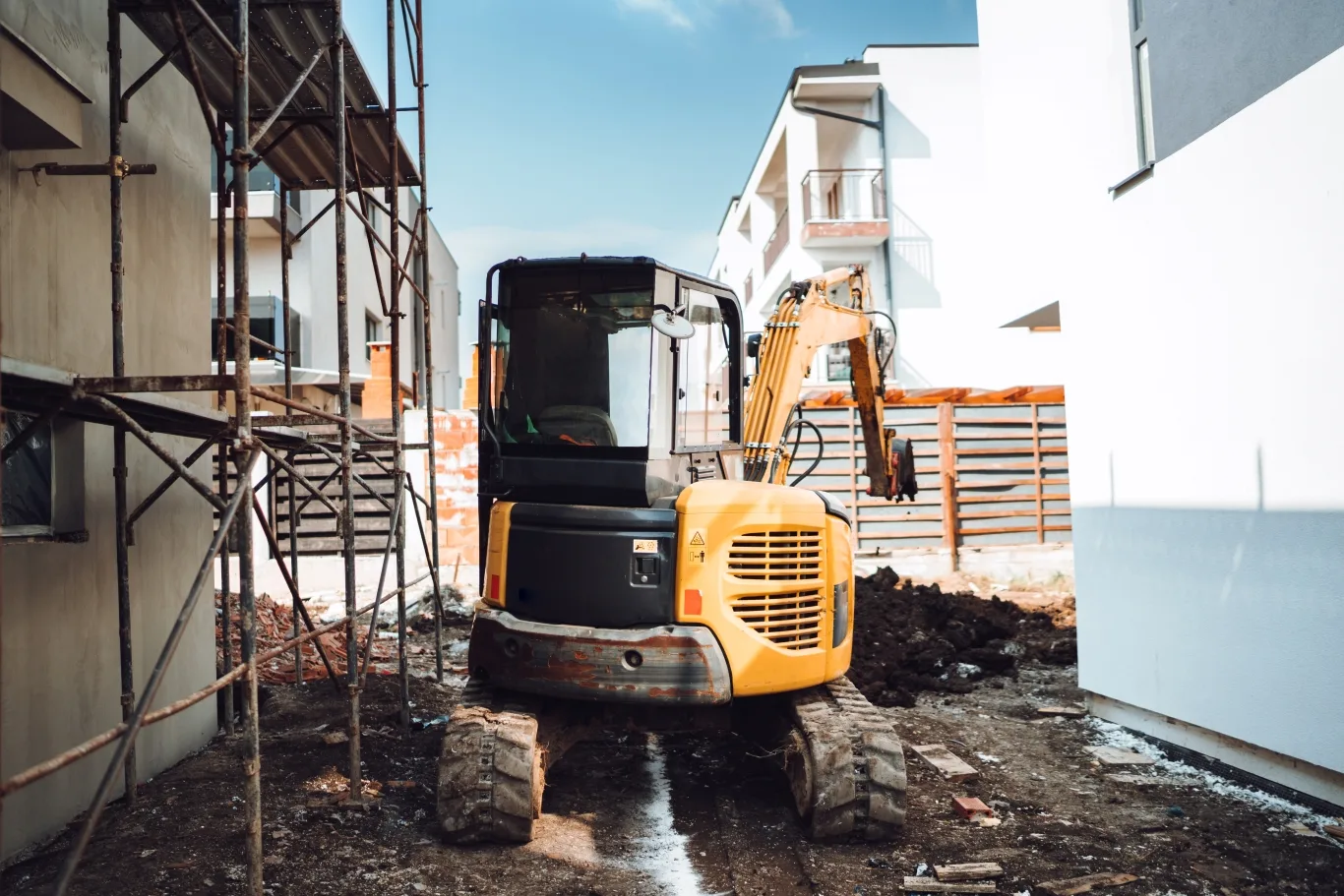 CAT 301.7 mini excavator operating at a compact construction site in Seattle – showcasing key features and performance benefits for those searching for CAT 301.7 mini excavator details.