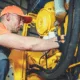 A heavy equipment maintenance & servicing expert doing his work at Williams Diesel LLC's site in Seattle.
