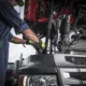 Technician performing diesel truck repair services on a heavy-duty vehicle in Seattle, ensuring engine performance and safety.