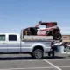 Ford F-350 truck loaded with recreational equipment showcasing its heavy-duty towing capacity and flatbed versatility – perfect for demanding transport needs, featuring Ford F-350 truck details in Seattle.