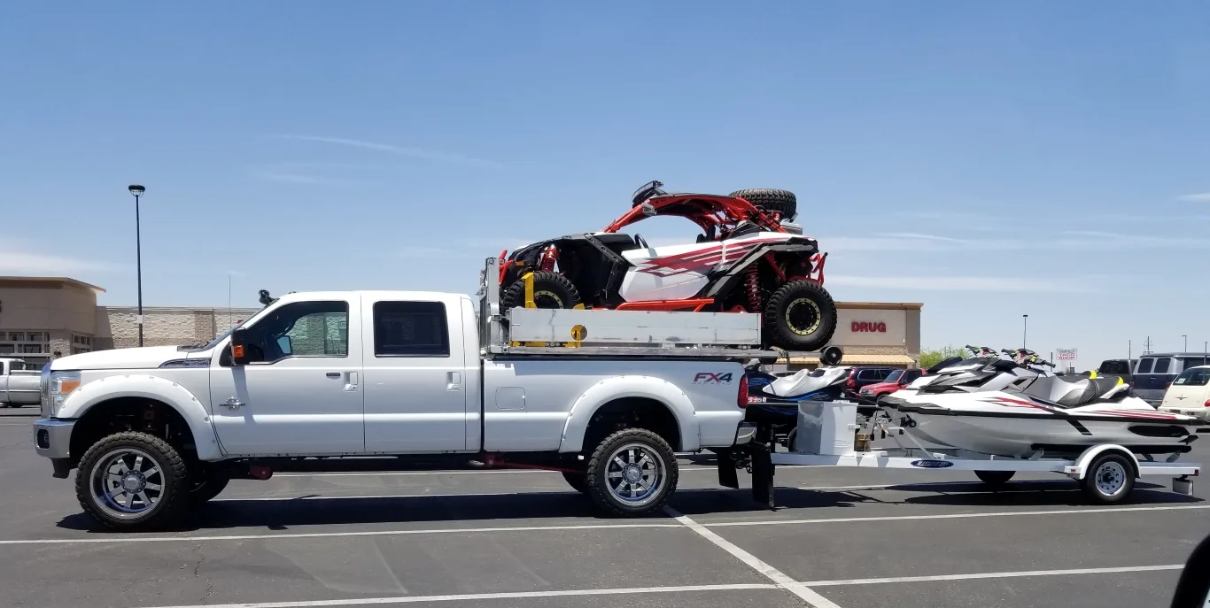 Ford F-350 truck loaded with recreational equipment showcasing its heavy-duty towing capacity and flatbed versatility – perfect for demanding transport needs, featuring Ford F-350 truck details in Seattle.