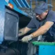 Experienced technician performing mobile diesel truck repair on a heavy-duty vehicle in Seattle, WA, showcasing on-site service efficiency and mechanical expertise.