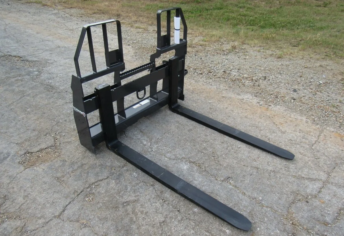 Heavy-duty 60 inch pallet fork attachment for lifting and moving materials, ideal for construction, agriculture, and warehouse operations.