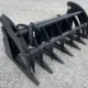 A heavy-duty log grapple attachment used for land clearing projects