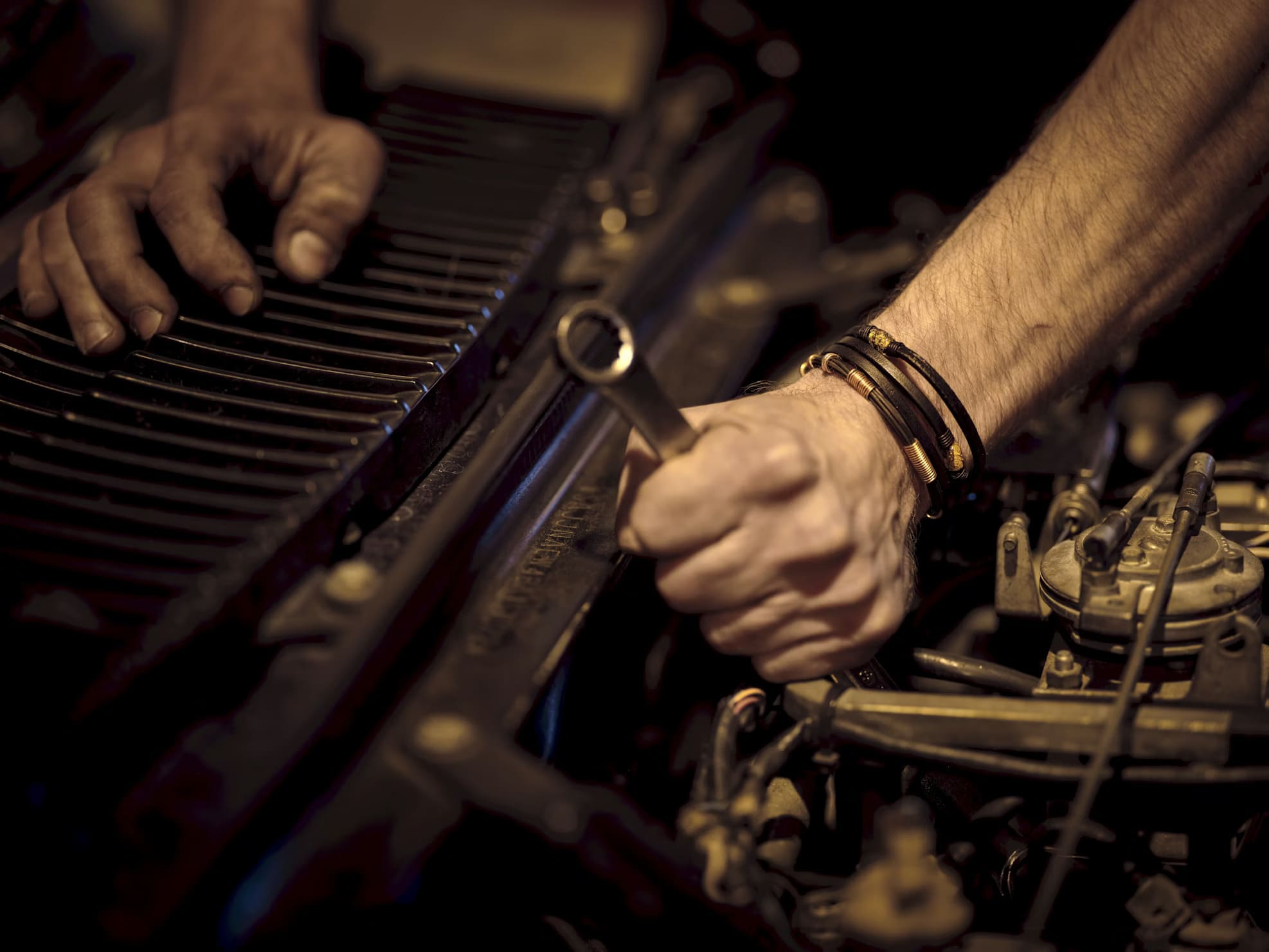 A specialized technician diagnosing common problems with diesel engines using a digital scanner in a professional repair shop to restore vehicle performance.