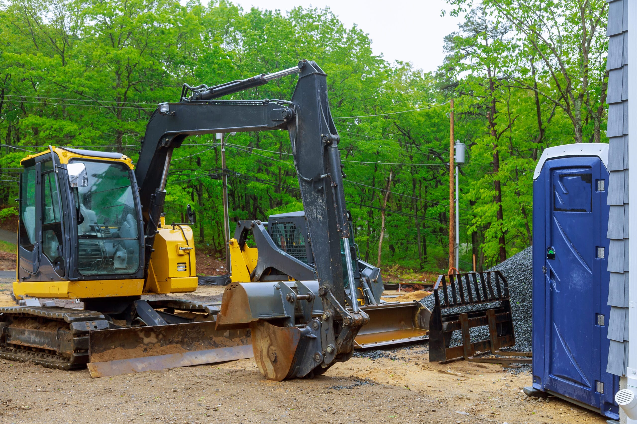 A line of immaculately maintained heavy earthmoving equipment and aerial lifts ready for dispatch through the premium williams equipment rentals fleet program in Washington.