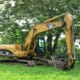 A Cat 303.5 mini excavator operating efficiently on a confined residential job site, showcasing how the balanced cat 303.5 weight prevents property damage.