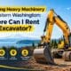 A heavy-duty compact digger working on a construction site answering where can i rent an excavator for Western Washington projects.